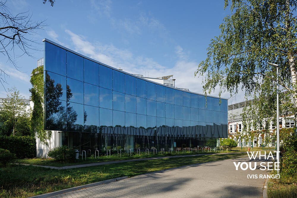 A glass office facade as people see it, clear and reflective
