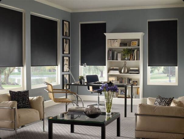 Roller shades installed over tinted windows