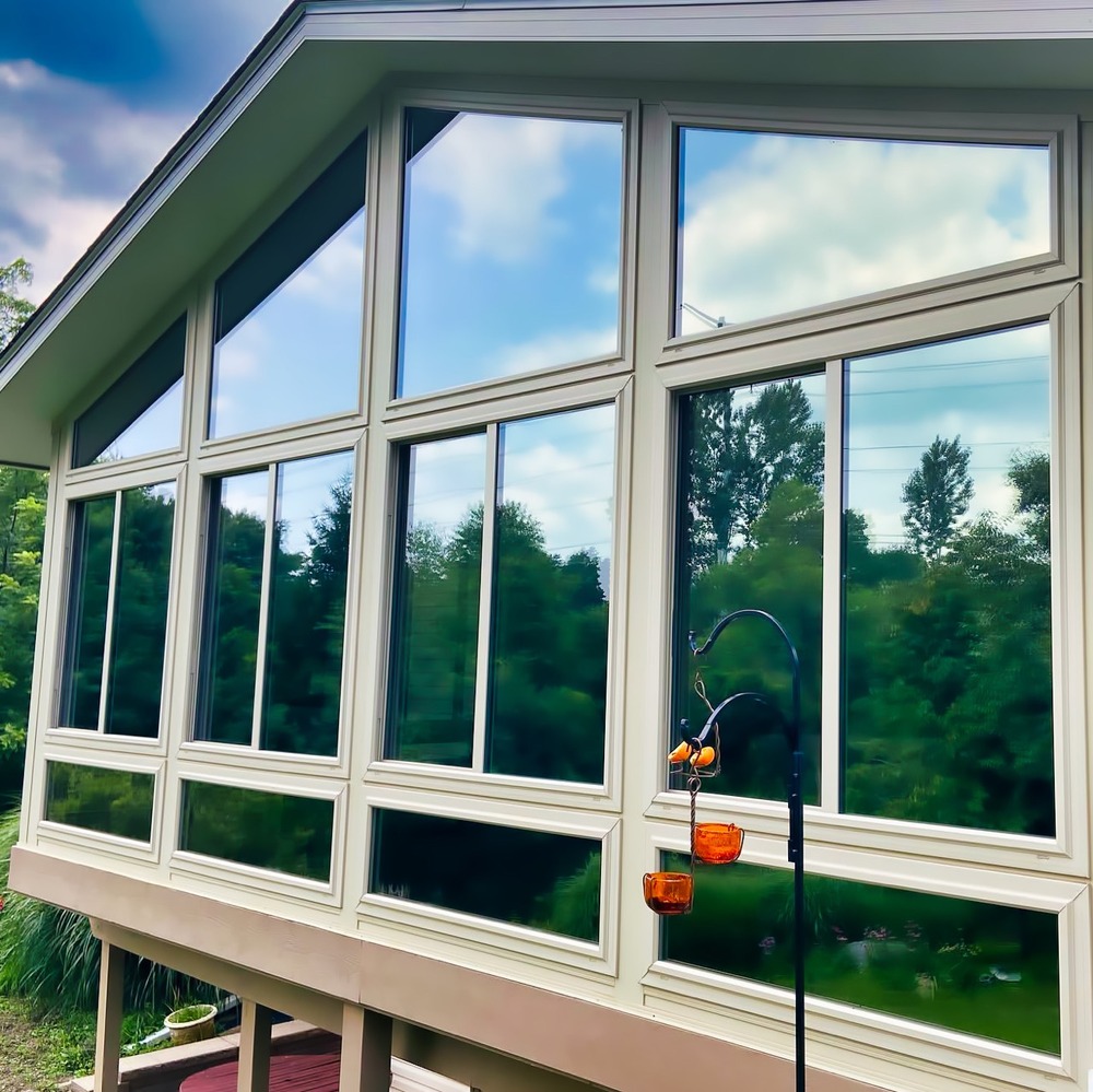 Dual reflective window tint on a Michigan sunroom