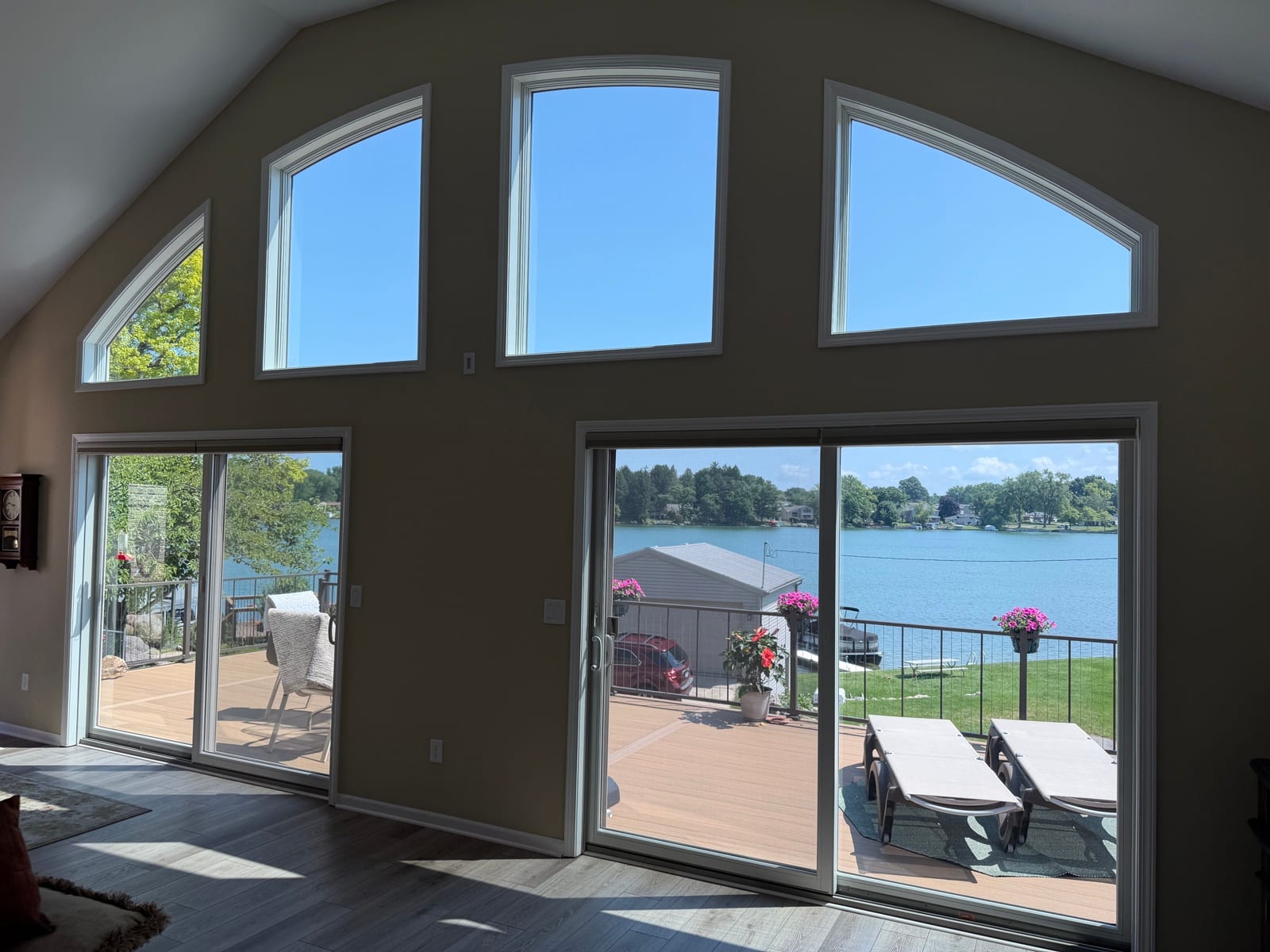 Tinted A-frame windows from inside a lake house