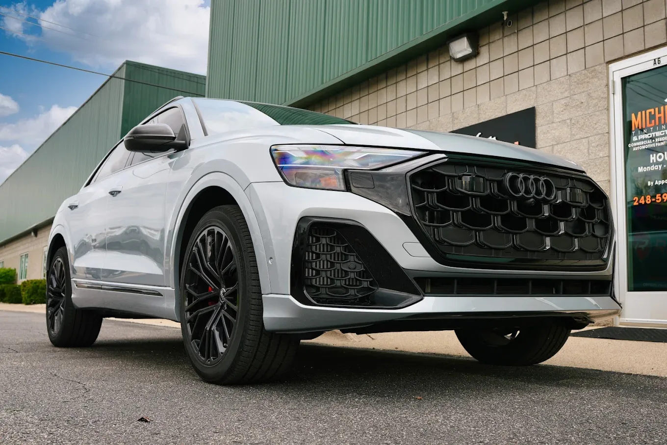 White Audi RS Q8 outside the Michigan Tinting shop