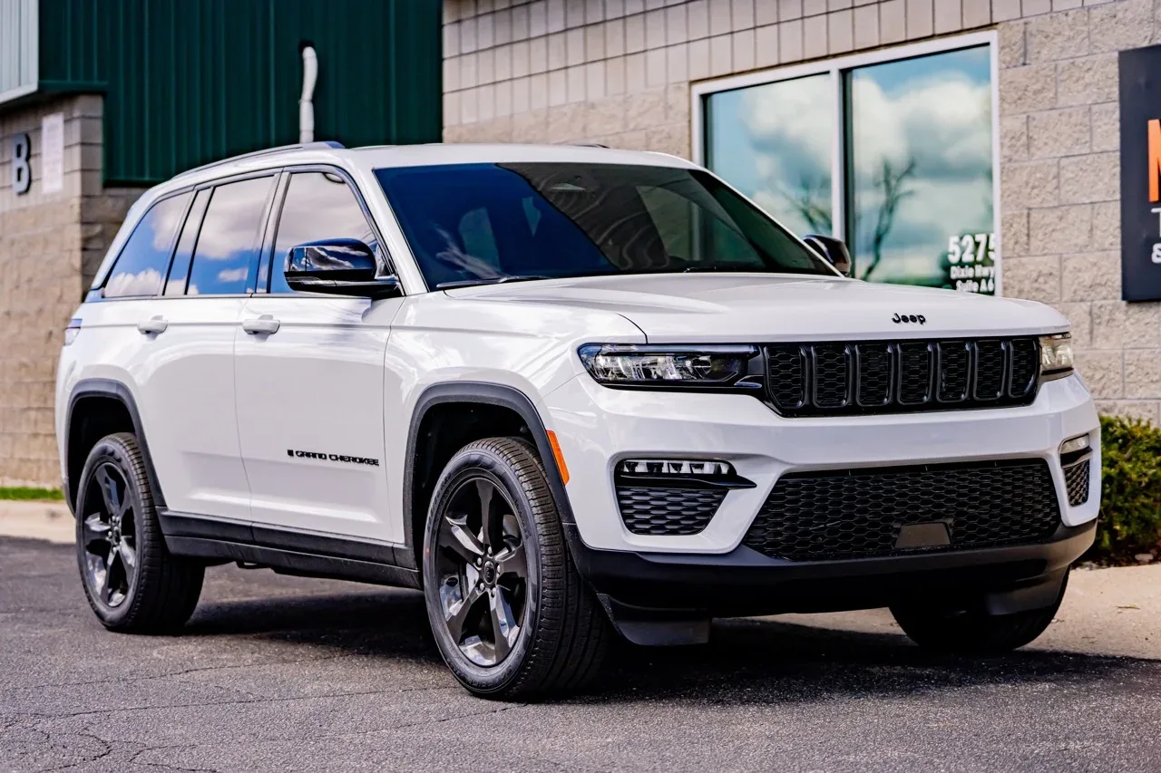 White Jeep Grand Cherokee at the shop