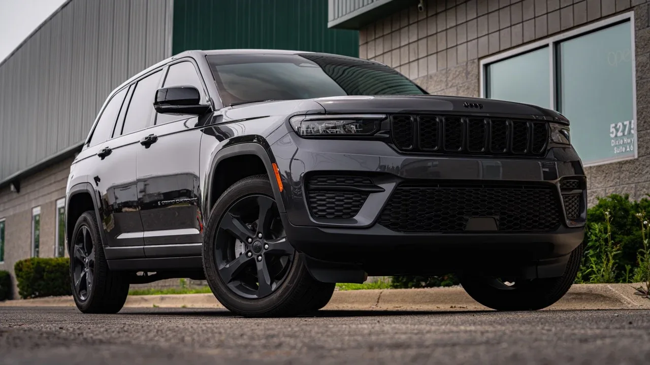 Black Jeep Grand Cherokee with dark window tint