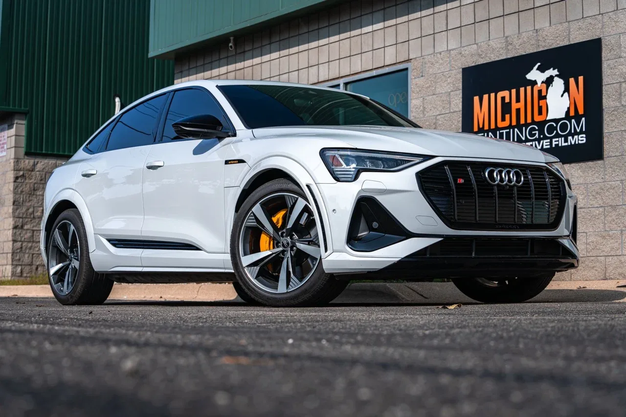 White Audi SUV with fresh tint at the shop