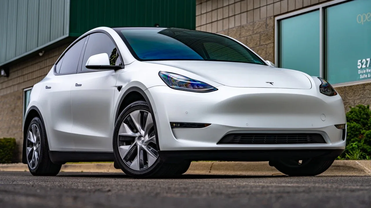 White Tesla Model Y outside the shop