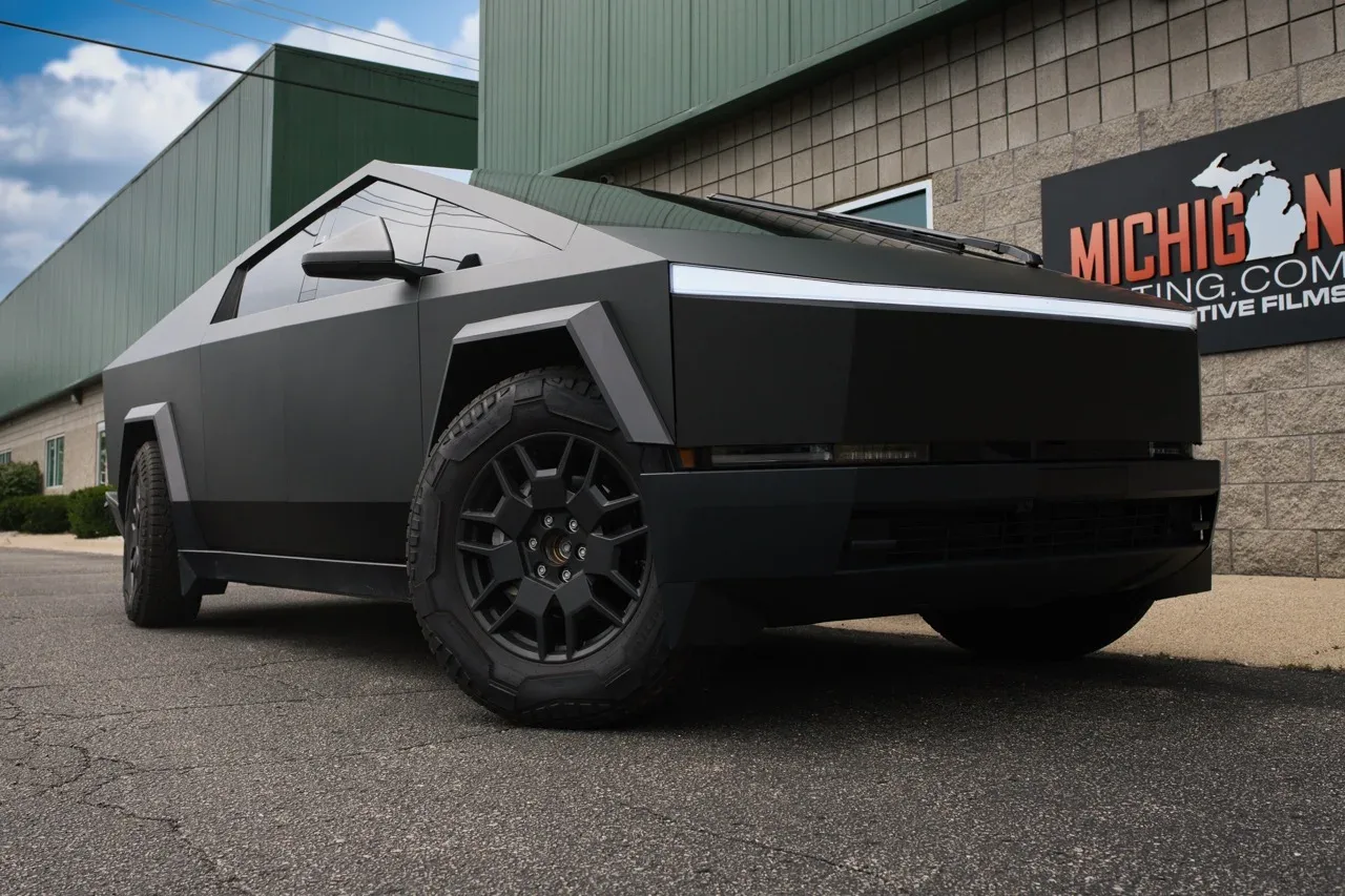 Tesla Cybertruck in a matte black wrap at the shop