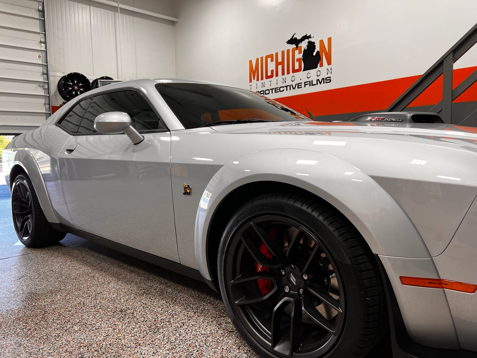 White Dodge Challenger widebody with tint and PPF