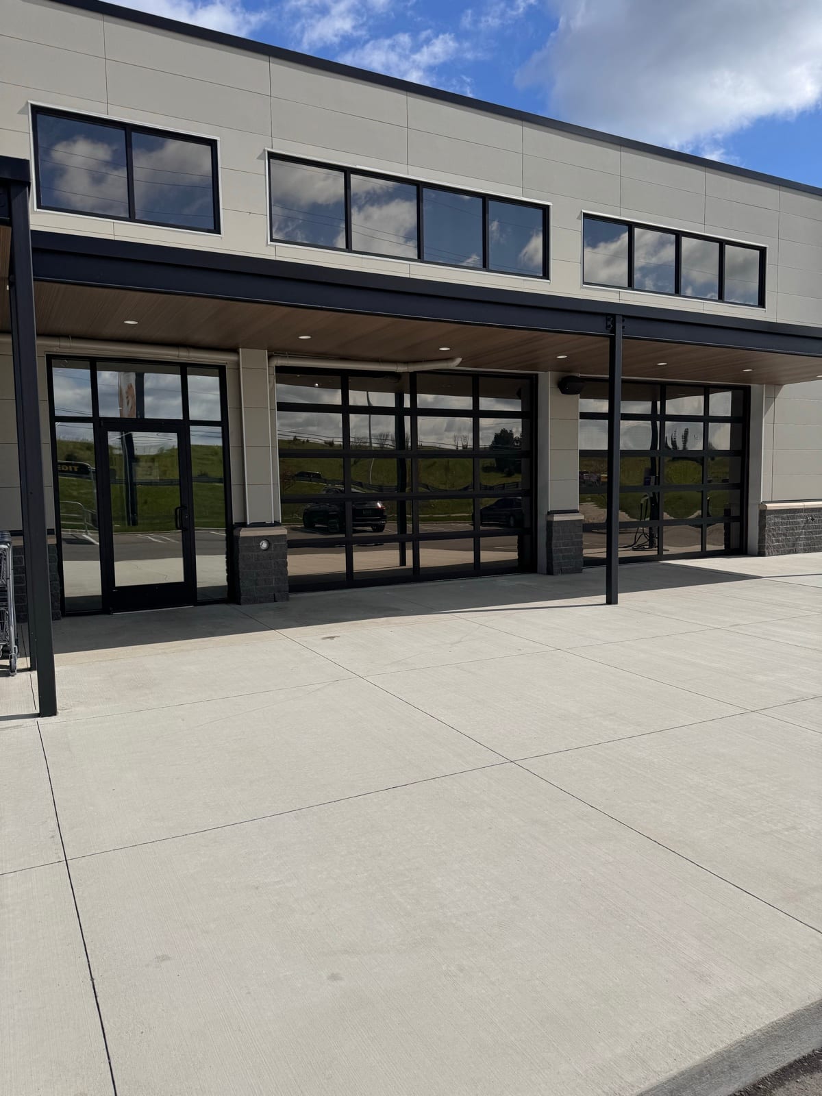 Commercial building with reflective heat-control window film