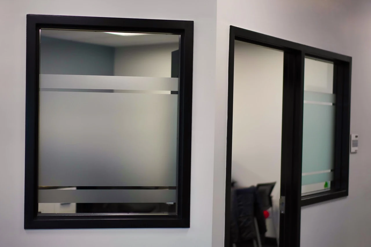 Office door and sidelight with a frosted privacy band