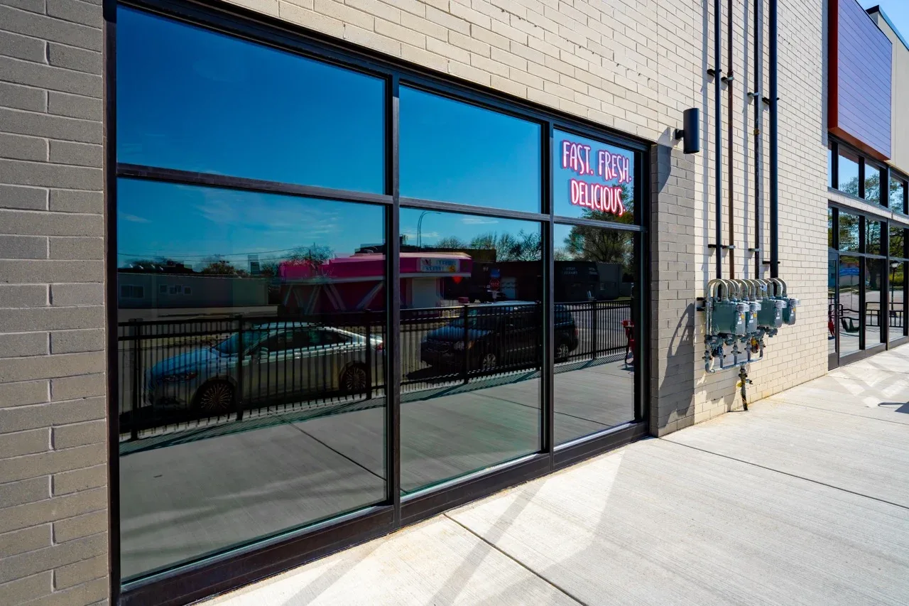 Tinted storefront glass on a commercial building