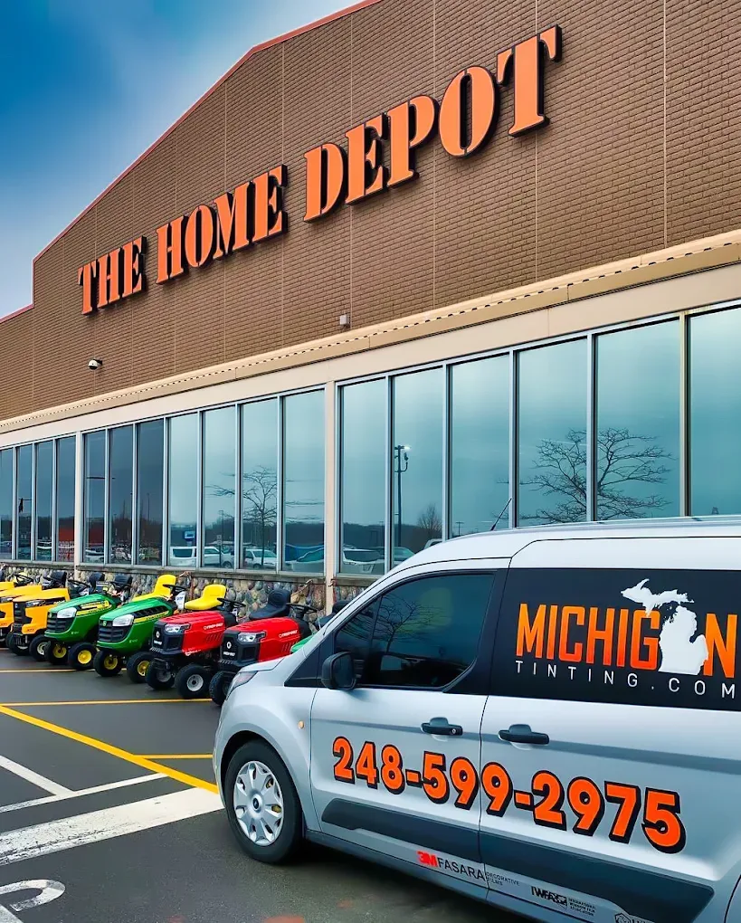The Michigan Tinting van outside a Home Depot storefront job