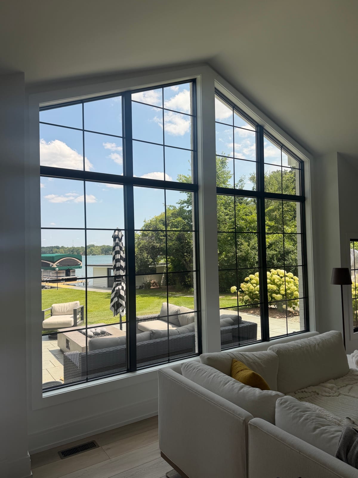 Living room with tinted windows facing the lake