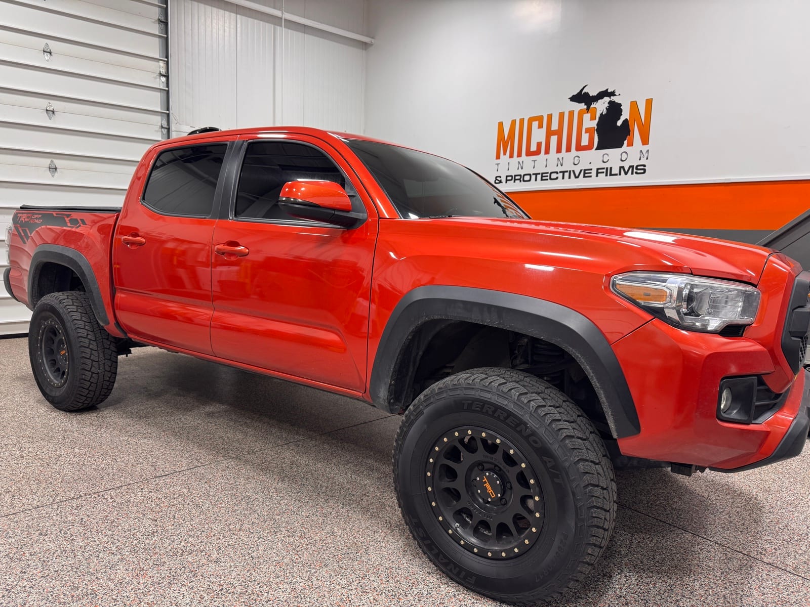 Red Toyota Tacoma with ceramic window tint