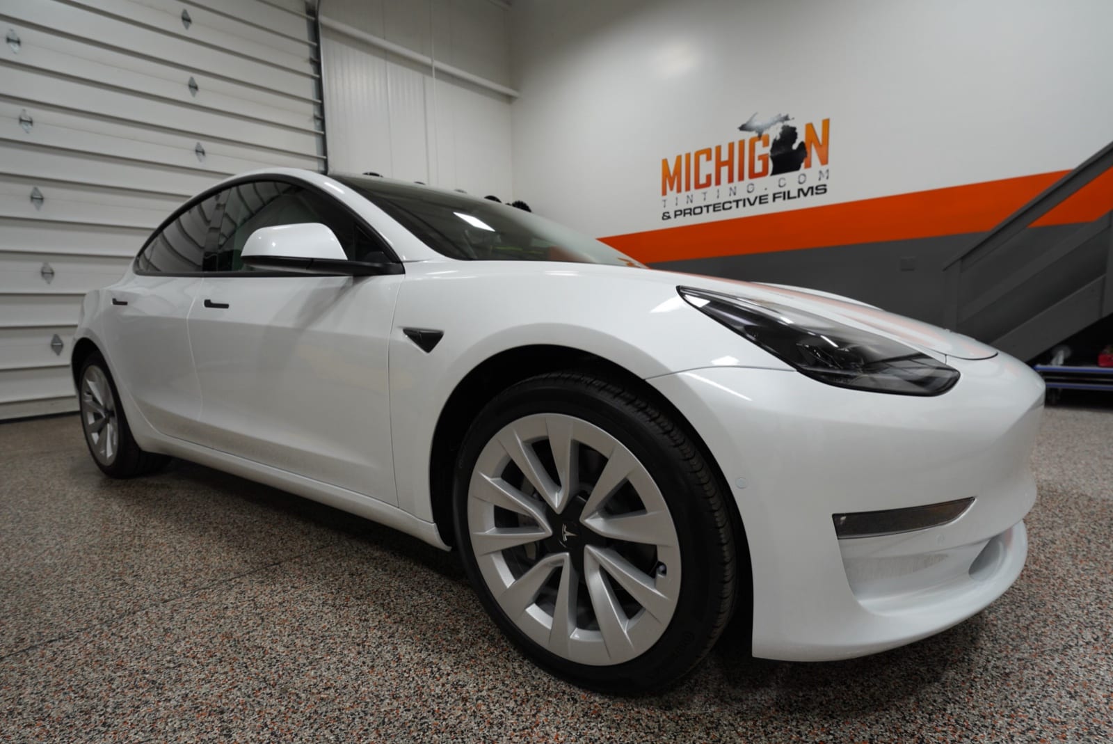 White Tesla Model 3 tinted in the shop